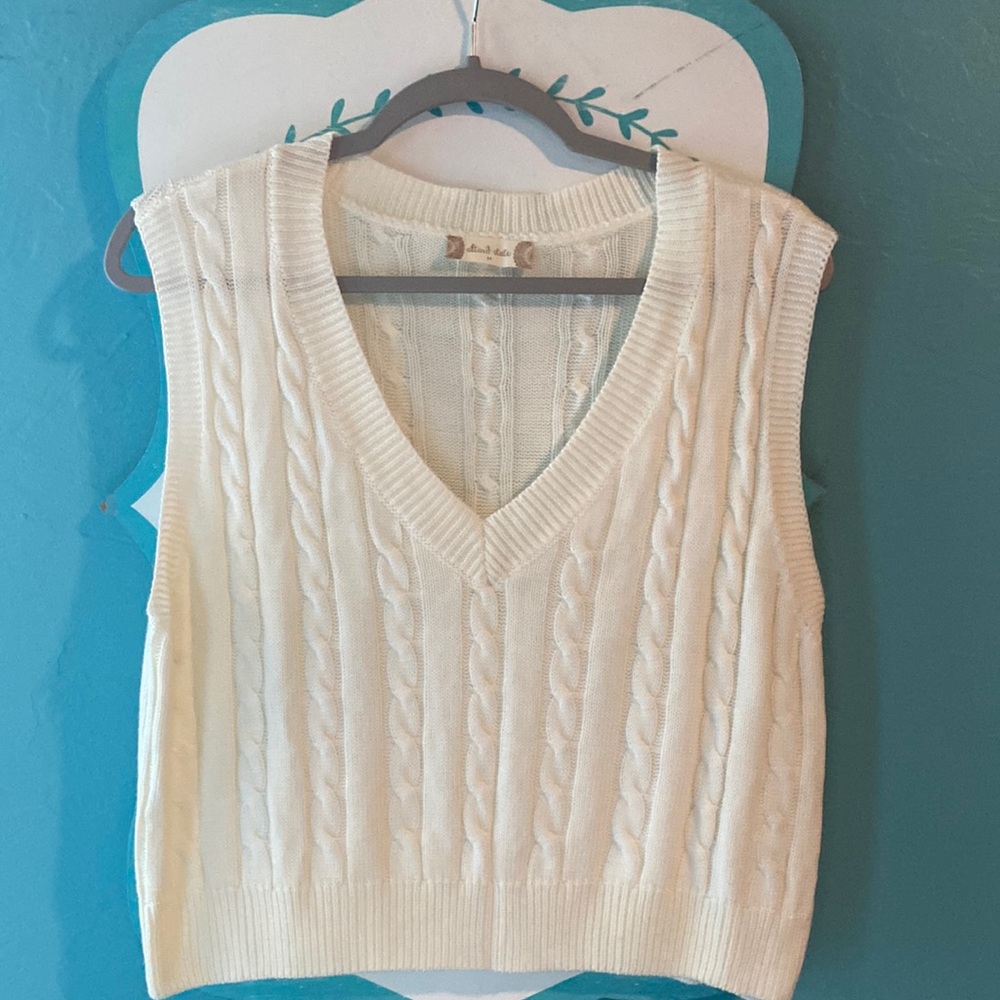 White sweater vest